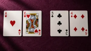 Two pairs of playing cards shown side by side to illustrate Pok Deng hand comparisons